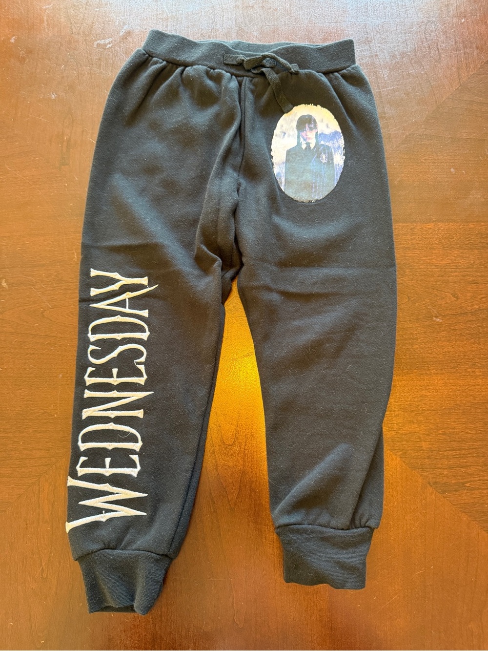 Wednesday Addams Family Black Joggers with 'Wednesday' Side Lettering and Pic XS